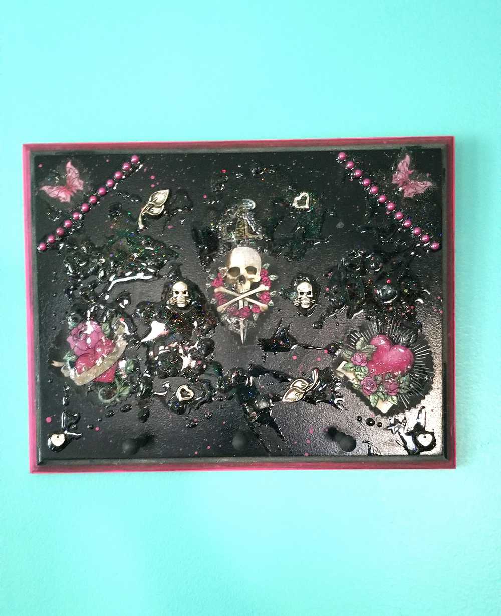 Black Goth Wall Plaque with a Skull with a Sword, Glass and Pink Butterflies