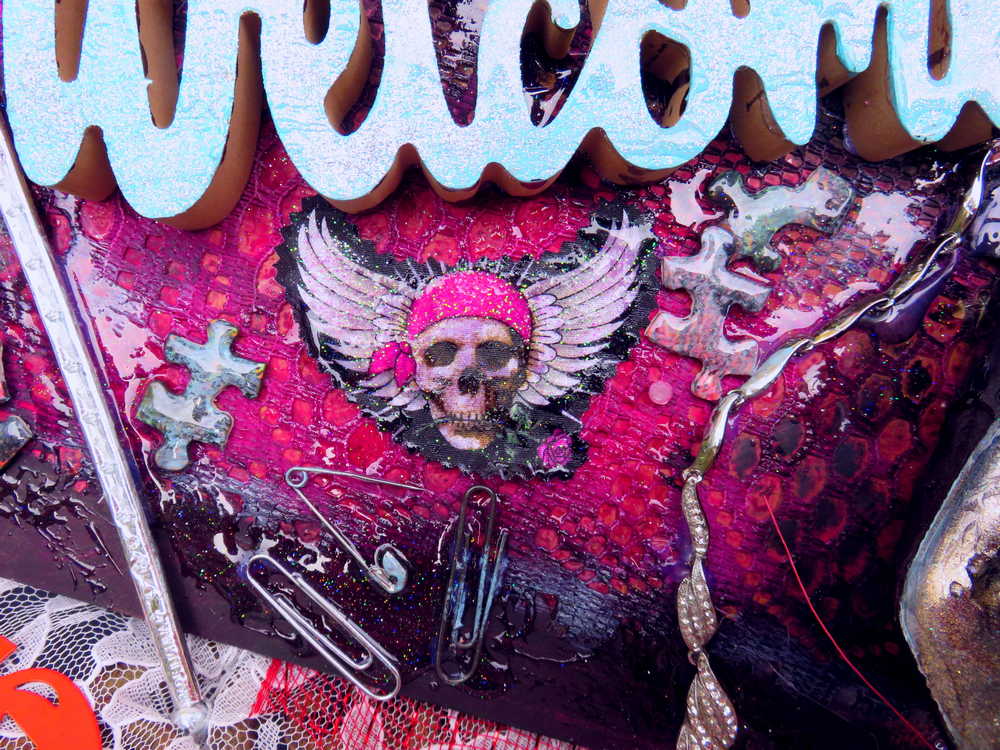 Welcome Sign With a Silver Colored Skull With  Piercings Wearing a Crown And Her Scepter