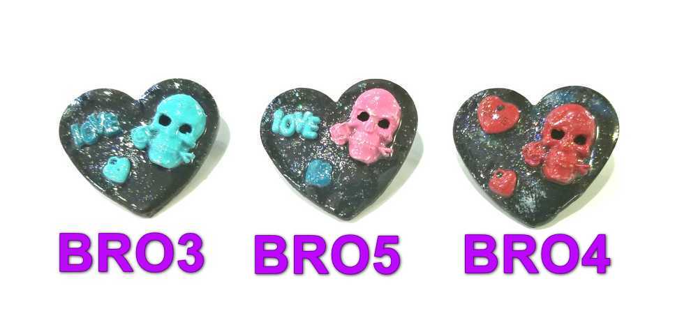 Black Porcelain Heart Shaped Brooch with a Pink Skull and a Teal Heart & Love Charm