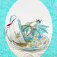 Fighting Dragons in a Vintage Teacup and Saucer Encased in Resin