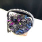 Wood Basket Covered with Black Skull Fabric, with a Purple & Black Flower, Blue Glass Cabochons & a Large Sparkley Spider