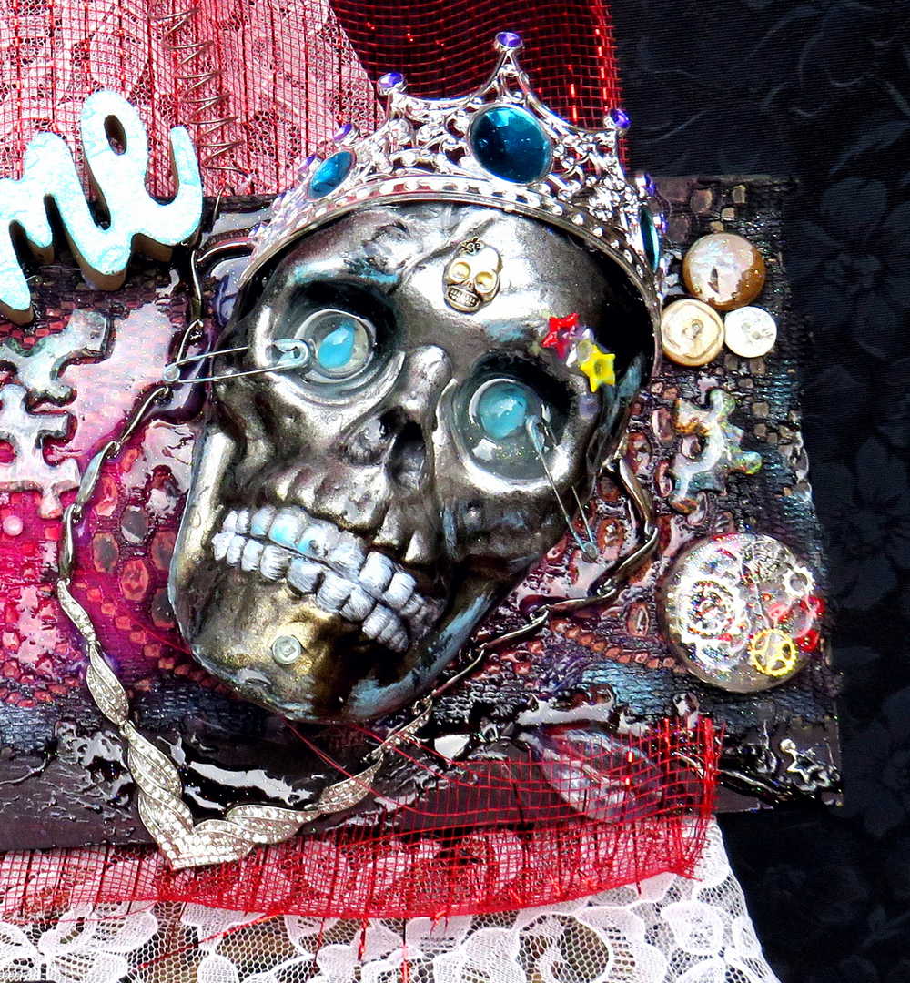 Welcome Sign With a Silver Colored Skull With  Piercings Wearing a Crown And Her Scepter