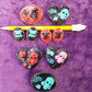 Porcelain Black Oval Shaped Brooch with Hand Painted Teal Skull, Heart & Love Charms