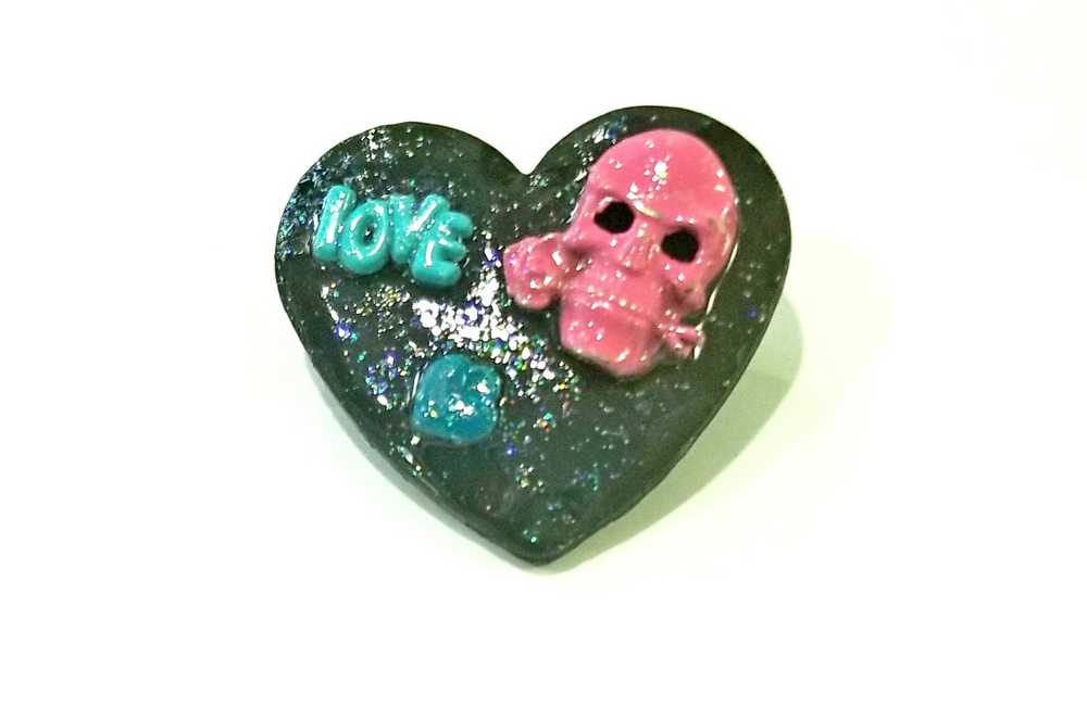 Black Porcelain Heart Shaped Brooch with a Pink Skull and a Teal Heart & Love Charm