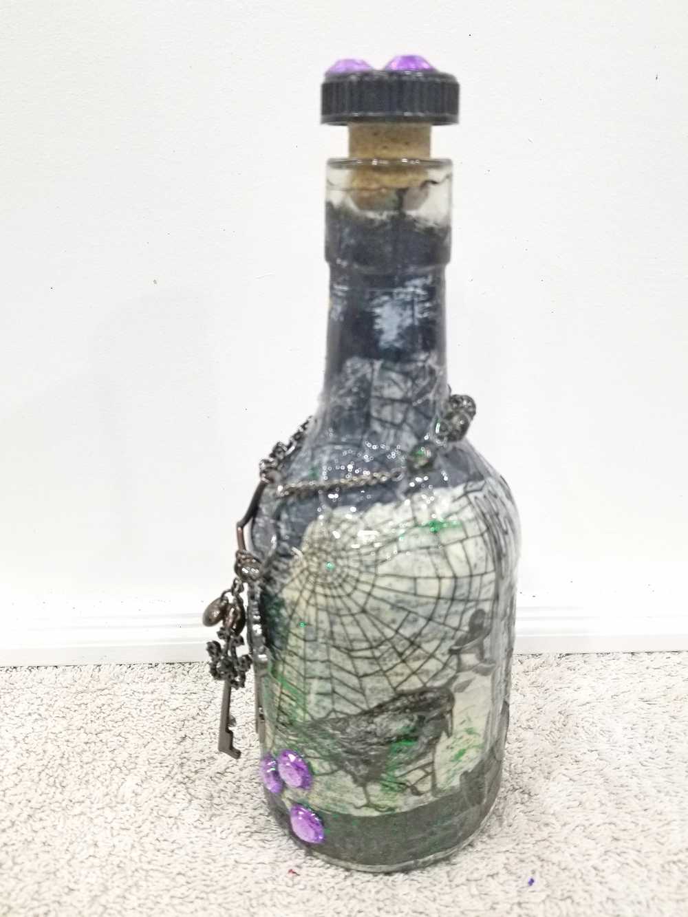 Altered Glass Bottle, Decanter, with a Crow, Chain with Keys, Purple Gems, Re-Usable