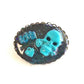 Porcelain Black Oval Shaped Brooch with Hand Painted Teal Skull, Heart & Love Charms