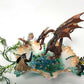 Fire-Breathing Dragon in Antique Glass Dish in a Fierce Fight for Survival