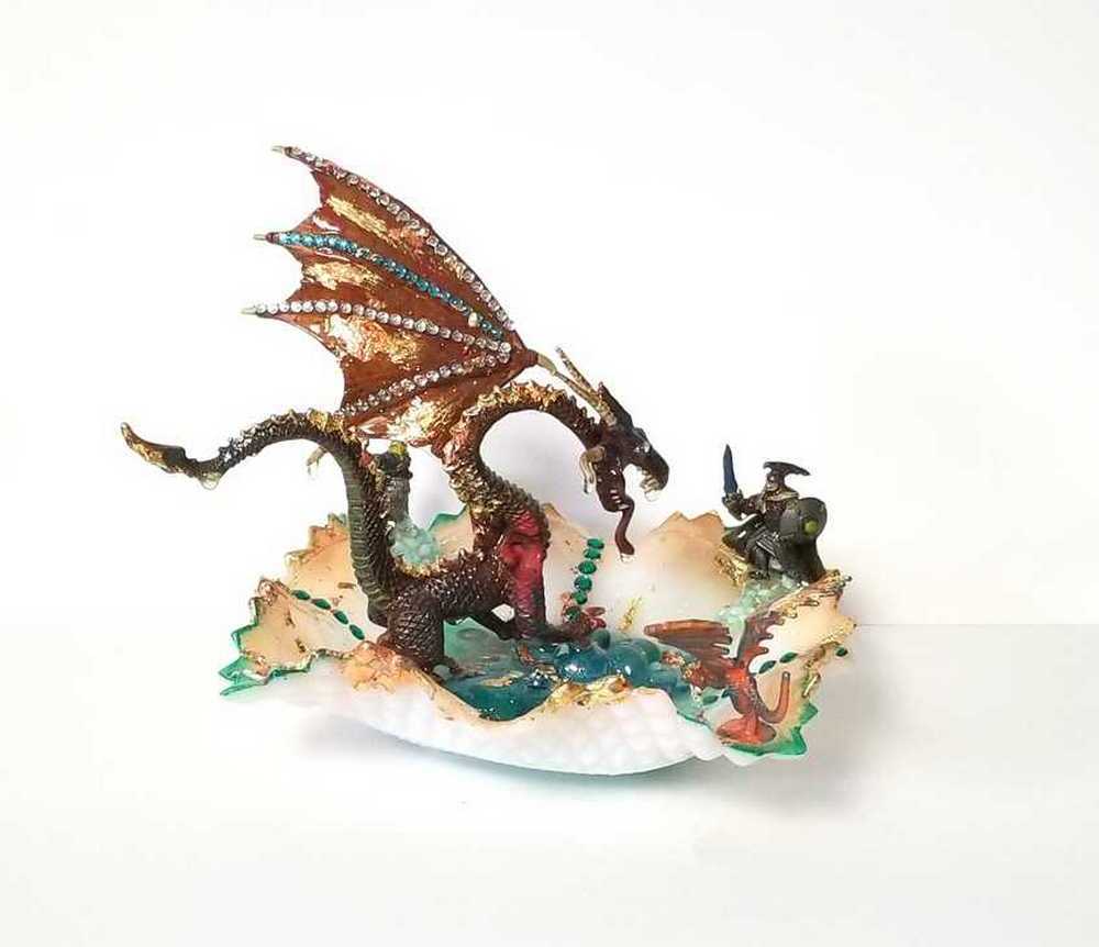 Fire-Breathing Dragon in Antique Glass Dish in a Fierce Fight for Survival