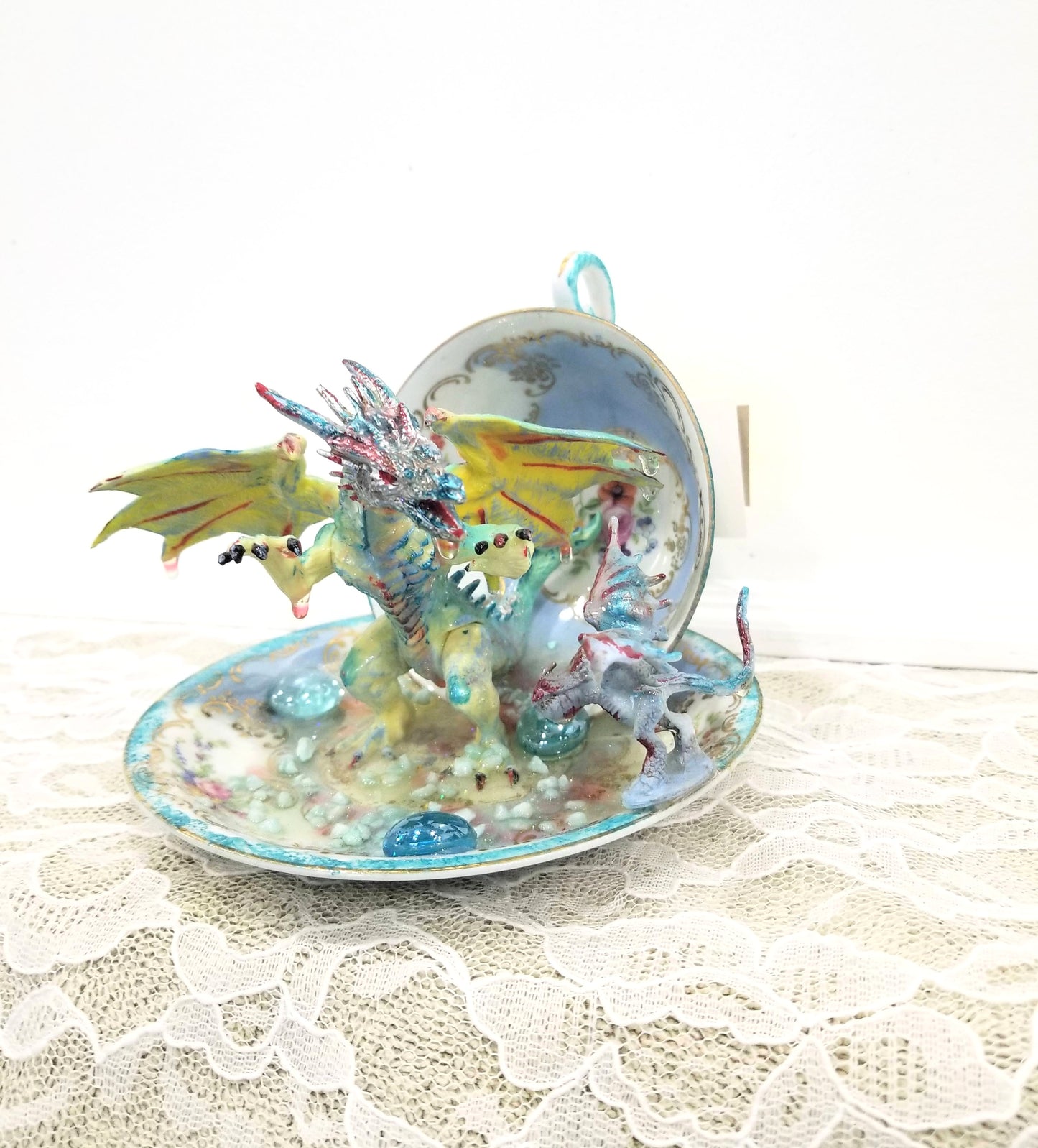 Fighting Dragons in a Vintage Teacup and Saucer Encased in Resin