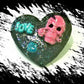 Black Porcelain Heart Shaped Brooch with a Pink Skull and a Teal Heart & Love Charm