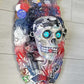 Skull Head Bottle Opener on Oval Slab of Wood, Surrounded by Darts, Dice, Poker Chips, Girlie Playing Cards, Smoking a BIg One