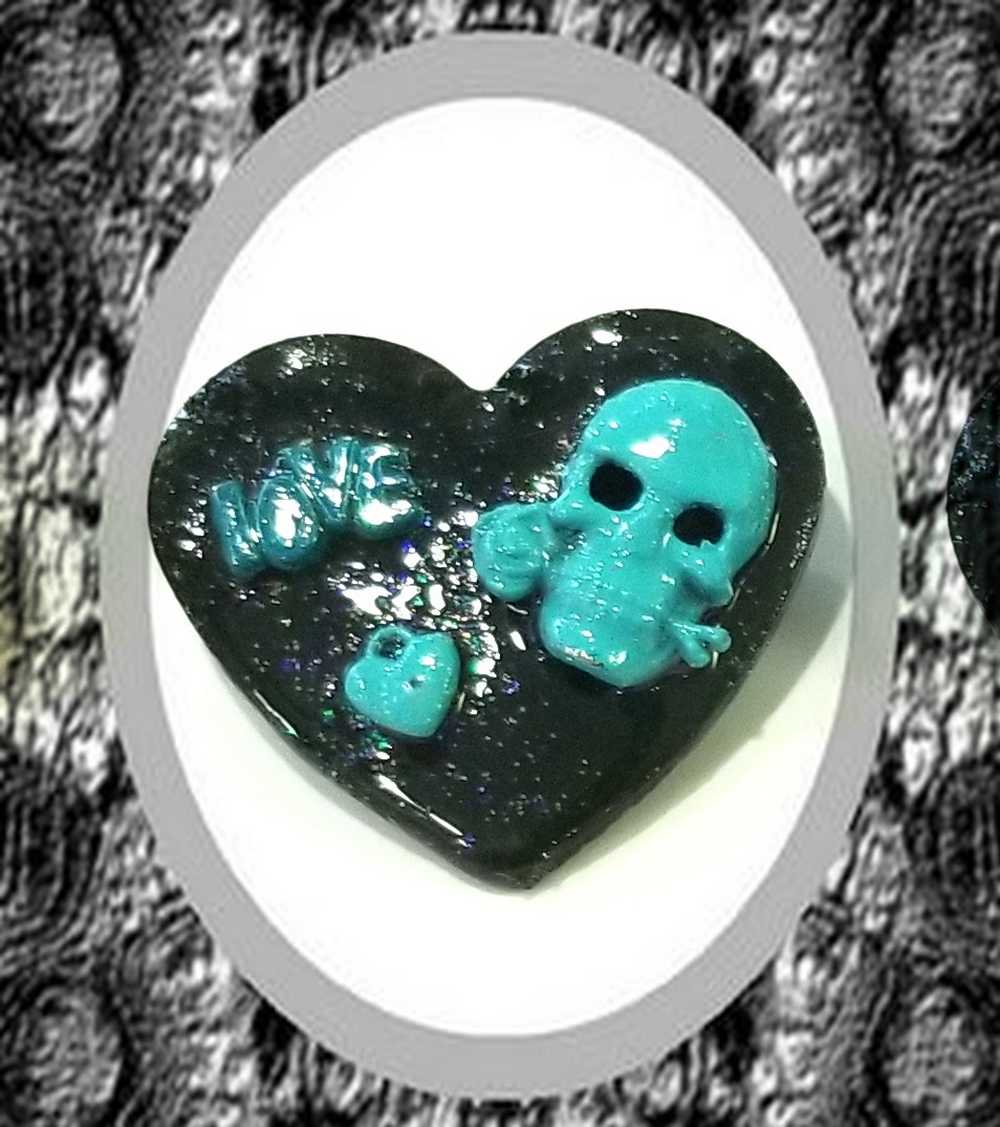 Black Porcelain Heart Shaped Brooch with a Teal Skull, Love and a Heart Charm