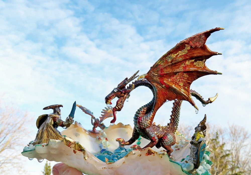 Fire-Breathing Dragon in Antique Glass Dish in a Fierce Fight for Survival