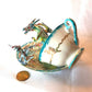 Fighting Dragons in a Vintage Teacup and Saucer Encased in Resin