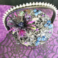 Wood Basket Covered with Black Skull Fabric, with a Purple & Black Flower, Blue Glass Cabochons & a Large Sparkley Spider