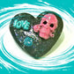 Black Porcelain Heart Shaped Brooch with a Pink Skull and a Teal Heart & Love Charm