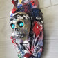 Skull Head Bottle Opener on Oval Slab of Wood, Surrounded by Darts, Dice, Poker Chips, Girlie Playing Cards, Smoking a BIg One