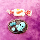 Porcelain Black Oval Shaped Brooch with Hand Painted Teal Skull, Heart & Love Charms