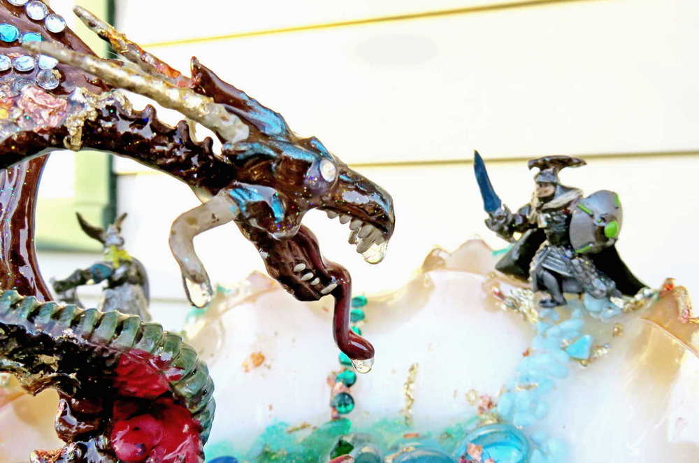 Fire-Breathing Dragon in Antique Glass Dish in a Fierce Fight for Survival