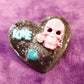 Black Porcelain Heart Shaped Brooch with a Pink Skull and a Teal Heart & Love Charm