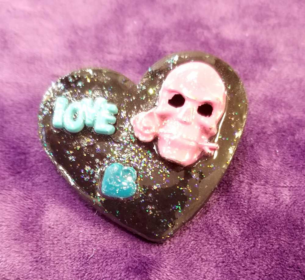 Black Porcelain Heart Shaped Brooch with a Pink Skull and a Teal Heart & Love Charm