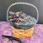 Wood Basket Covered with Black Skull Fabric, with a Purple & Black Flower, Blue Glass Cabochons & a Large Sparkley Spider