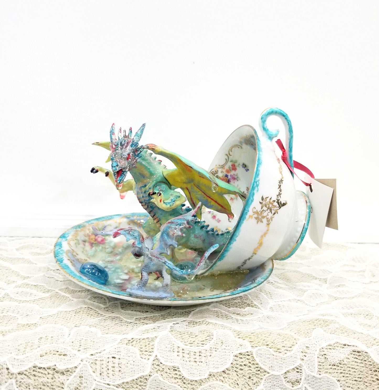 Fighting Dragons in a Vintage Teacup and Saucer Encased in Resin