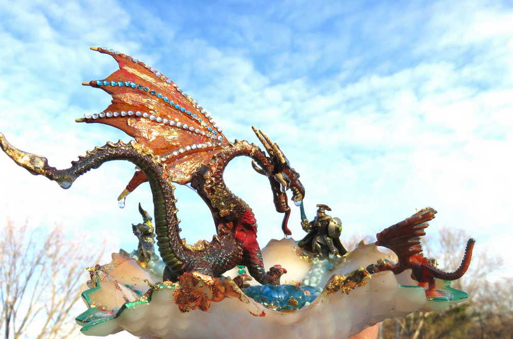 Fire-Breathing Dragon in Antique Glass Dish in a Fierce Fight for Survival