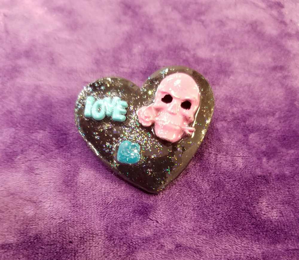 Black Porcelain Heart Shaped Brooch with a Pink Skull and a Teal Heart & Love Charm