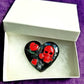 Black Porcelain Heart Shaped Brooch with Red Skull and Heart Charms