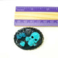 Porcelain Black Oval Shaped Brooch with Hand Painted Teal Skull, Heart & Love Charms