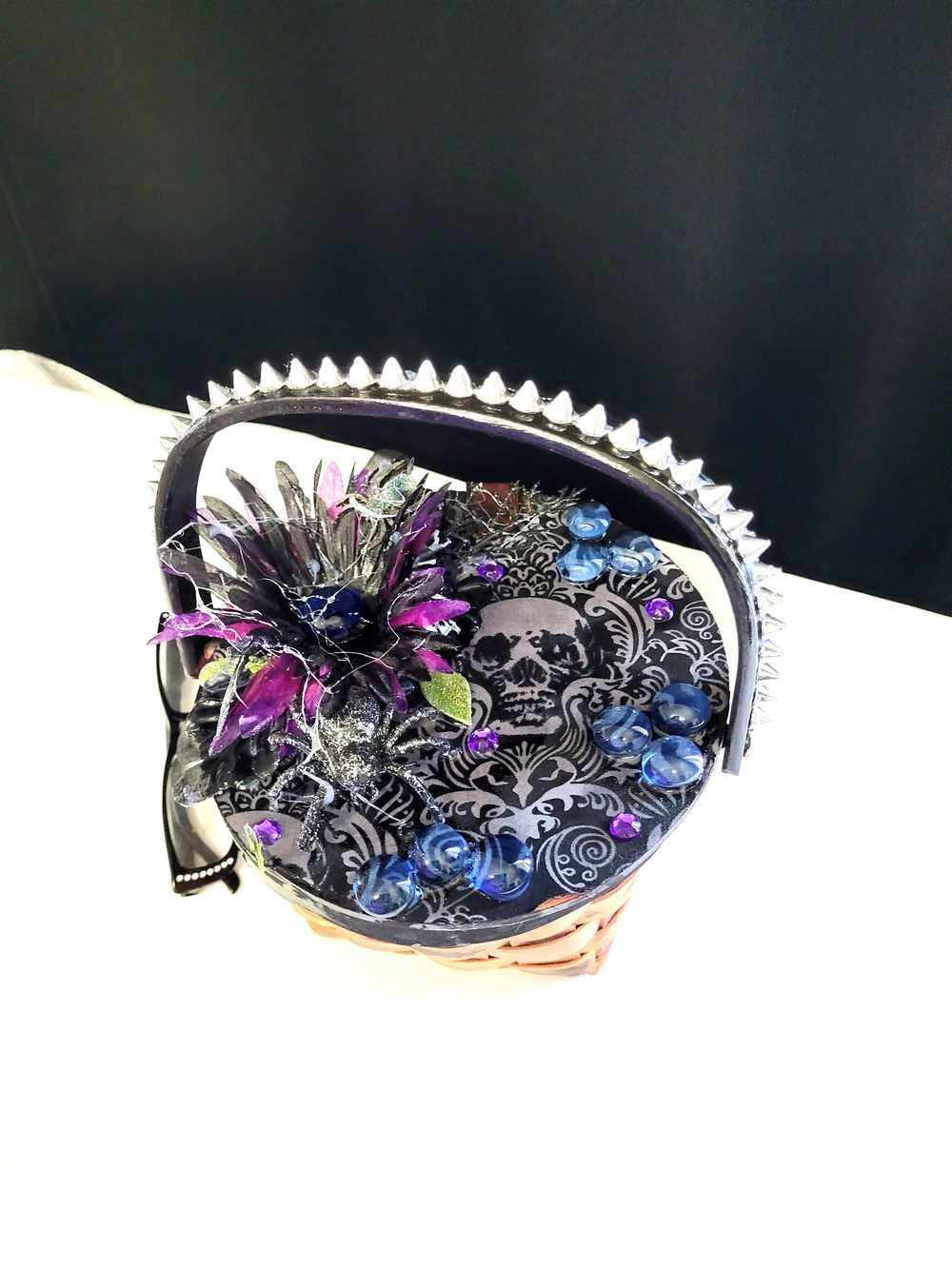 Wood Basket Covered with Black Skull Fabric, with a Purple & Black Flower, Blue Glass Cabochons & a Large Sparkley Spider