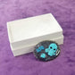 Porcelain Black Oval Shaped Brooch with Hand Painted Teal Skull, Heart & Love Charms