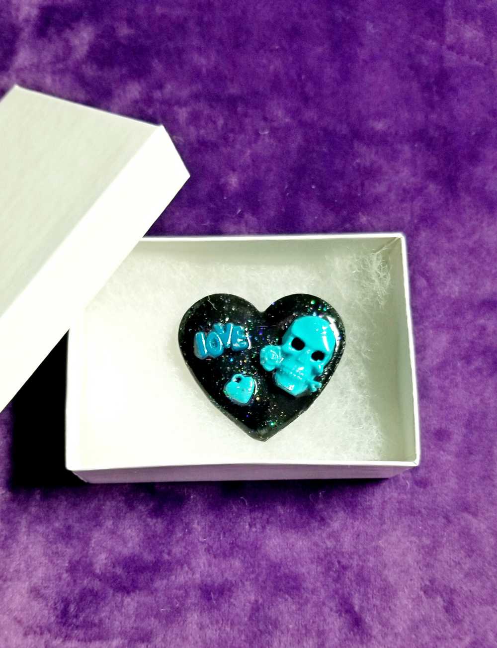 Black Porcelain Heart Shaped Brooch with a Teal Skull, Love and a Heart Charm