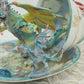 Fighting Dragons in a Vintage Teacup and Saucer Encased in Resin