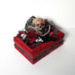 Small Red and Black Jewelry Box with a Skull and a Red Rose
