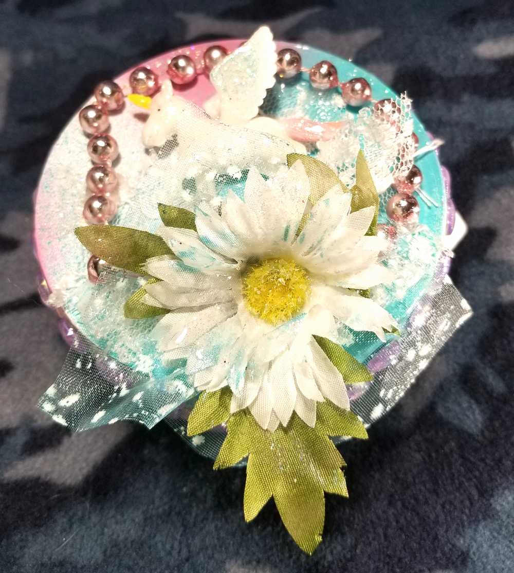 Recycled Round Jewelry Box with a Flying Pink Unicorn and a Daisy