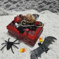 Small Red and Black Jewelry Box with a Skull and a Red Rose