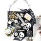 Skull & Bones Wall Plaque in Black & Gold, with Curly Wire Ribbon "No Regrets"