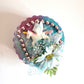 Recycled Round Jewelry Box with a Flying Pink Unicorn and a Daisy