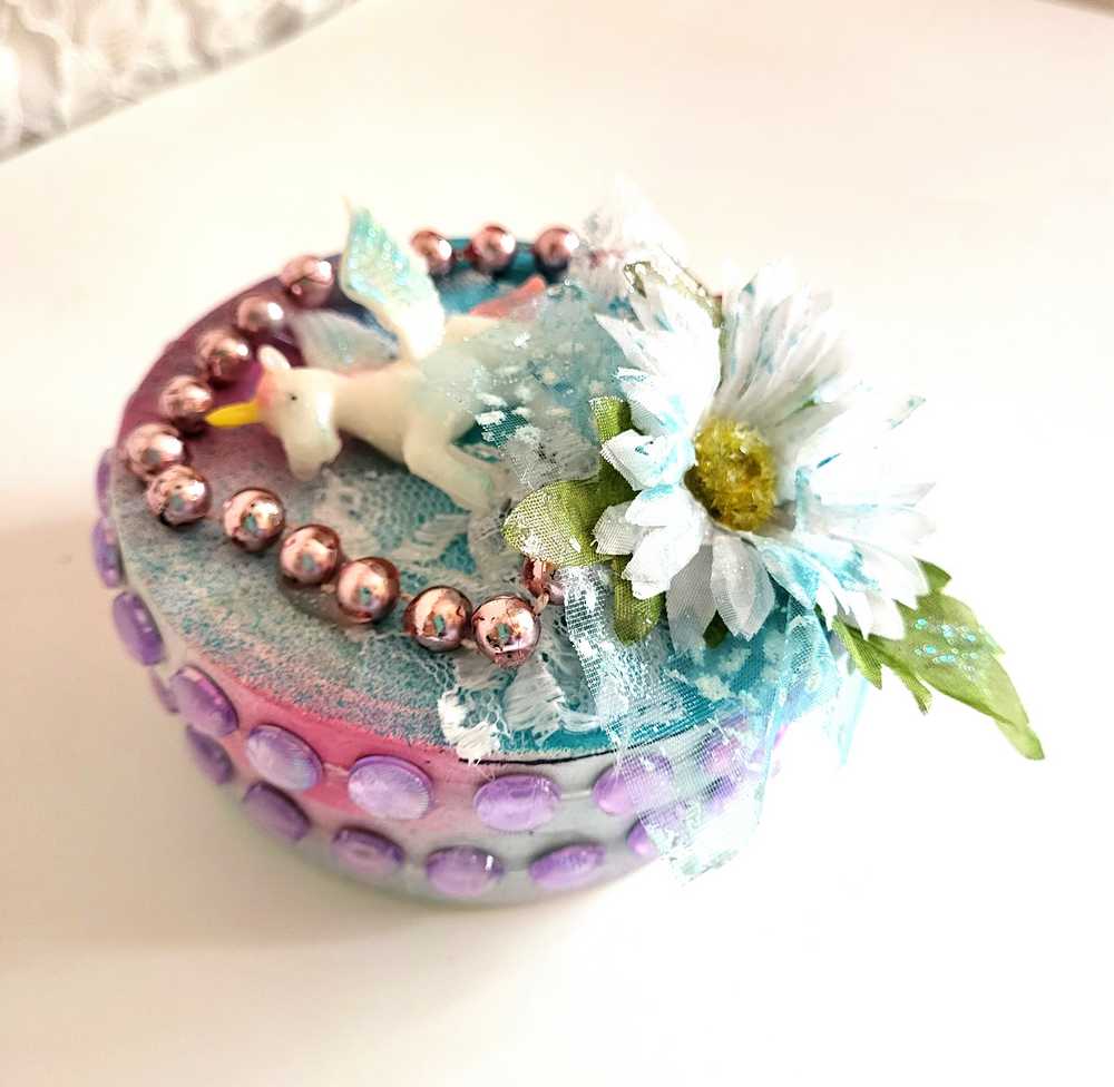 Recycled Round Jewelry Box with a Flying Pink Unicorn and a Daisy