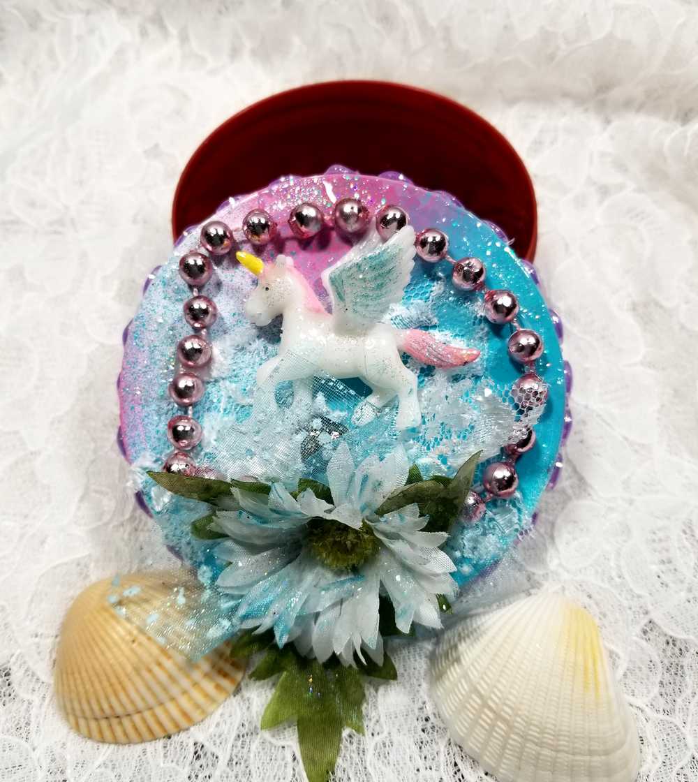 Recycled Round Jewelry Box with a Flying Pink Unicorn and a Daisy