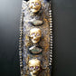 3 Skulls on a Spiked Plaque