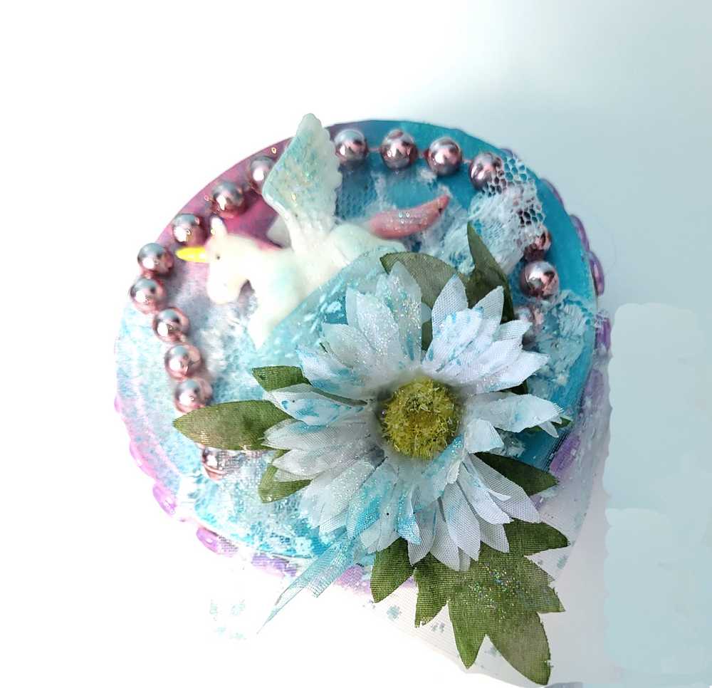 Recycled Round Jewelry Box with a Flying Pink Unicorn and a Daisy