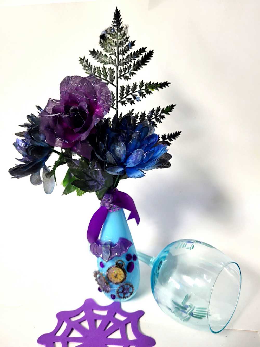 Teal Glass Vase with Skull, Purple Rose and Gears