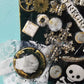 Skull & Bones Wall Plaque in Black & Gold, with Curly Wire Ribbon "No Regrets"