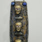 3 Skulls on a Spiked Plaque