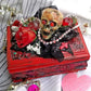 Small Red and Black Jewelry Box with a Skull and a Red Rose