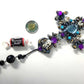 Plastic Cross and Skull Ornament with Teal and Purple Rhinestones
