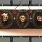 3D Family Portraits of a Handsome Skull Family on a Wall Plaque